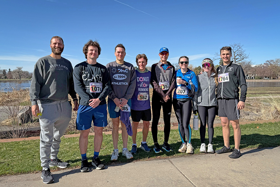 runners pose together outside