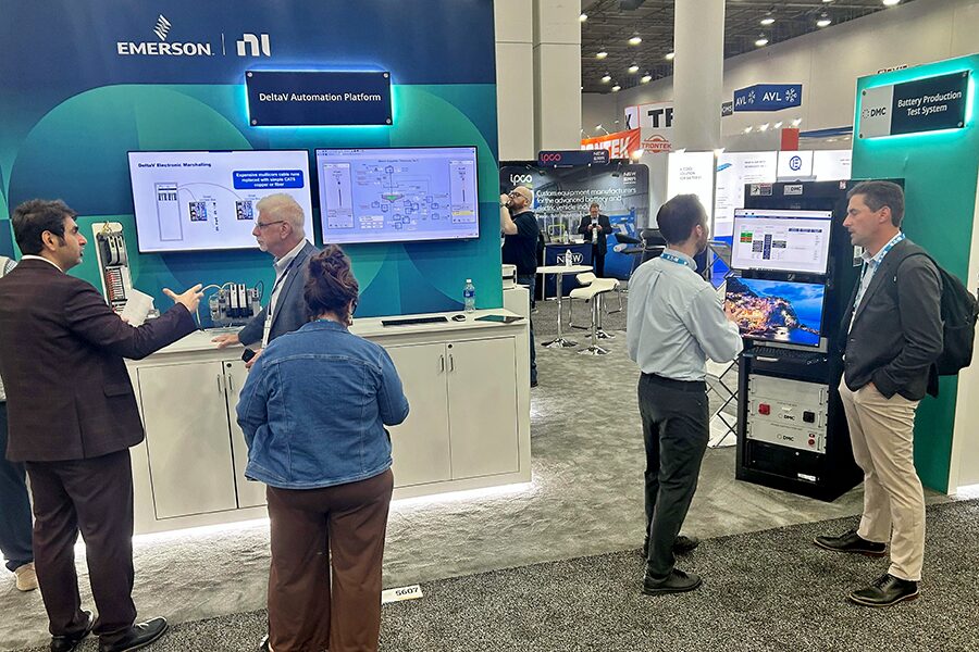 People looking at a trade show booth