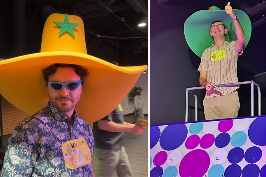 Two men wear giant hats