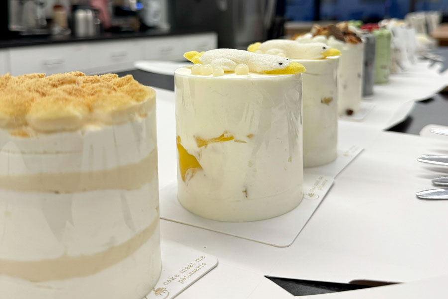 Cakes lined up on a counter