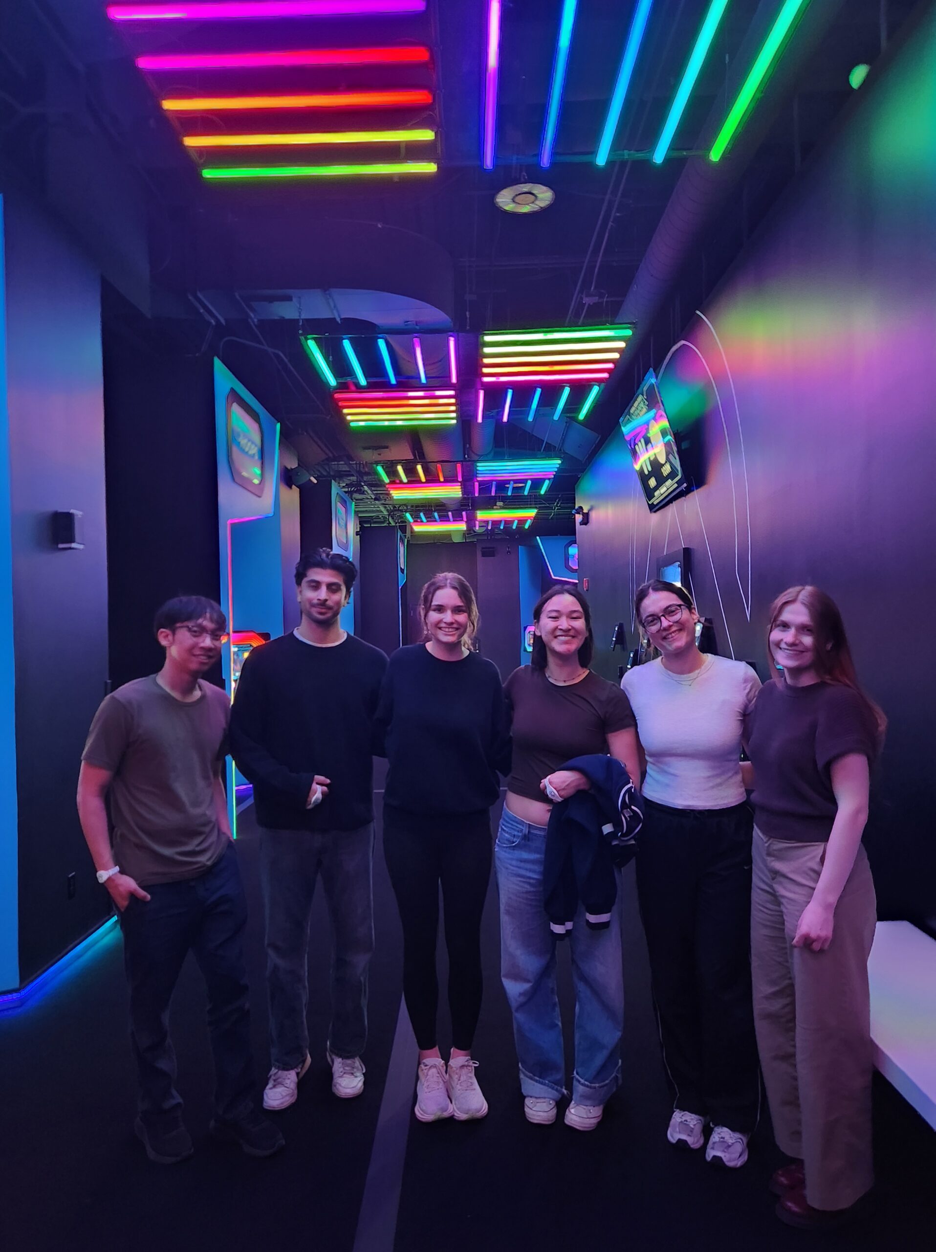 DMC employees posing together at Activate Games.
