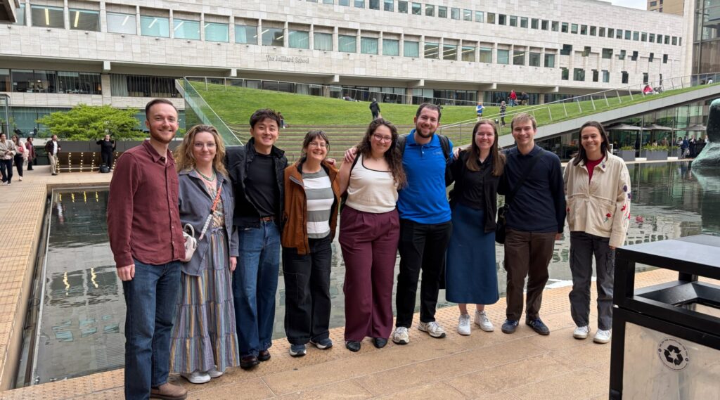 DMC team members standing in front of the pond at the Vivian Beaumont Theater.