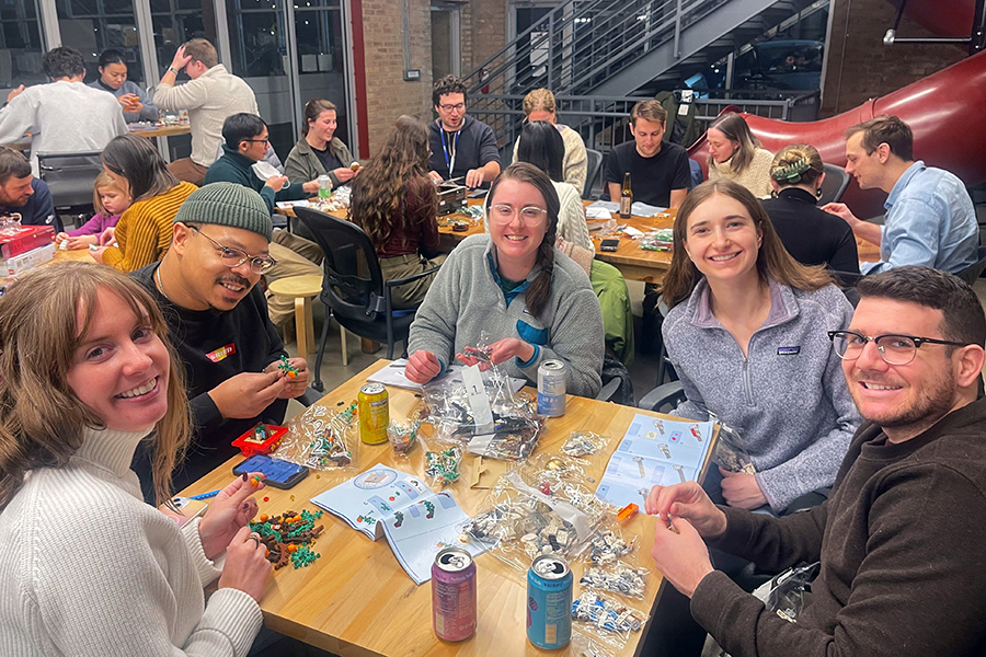 Image of DMC employees at a previous year's LEGO activity.
