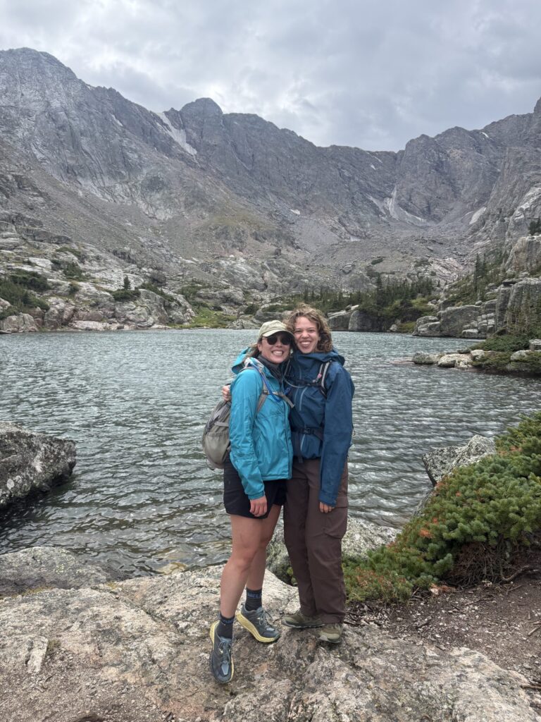 Two DMC employees pictured in front of Lake of Glass