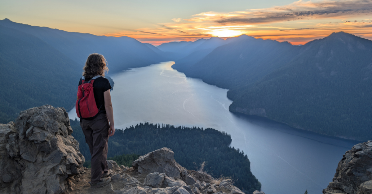 DMC engineer looking down at the view from Mount Storm King