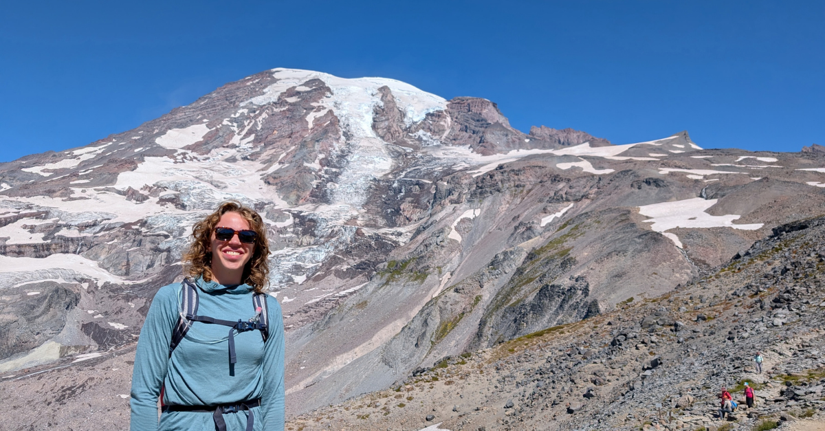 DMC engineer with Mount Rainier in the background