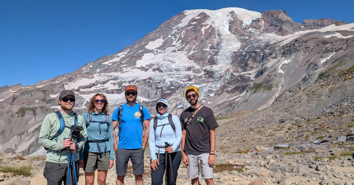 DMC engineers with Mount Rainier peak in the background