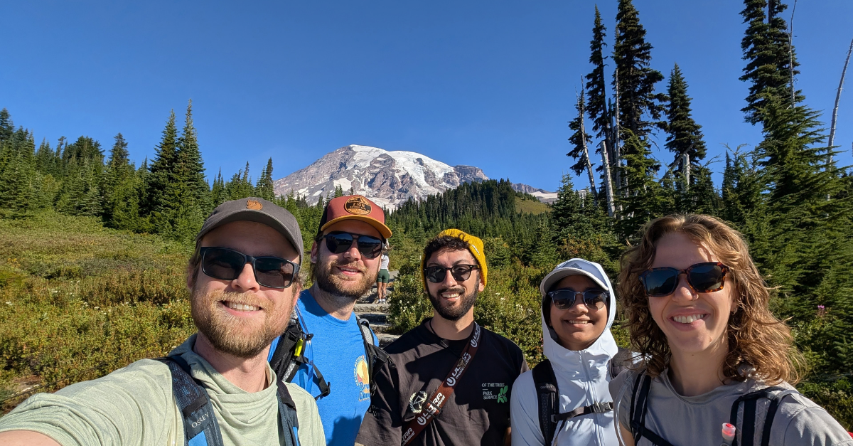 DMC engineers posing at the base of Mount Rainier