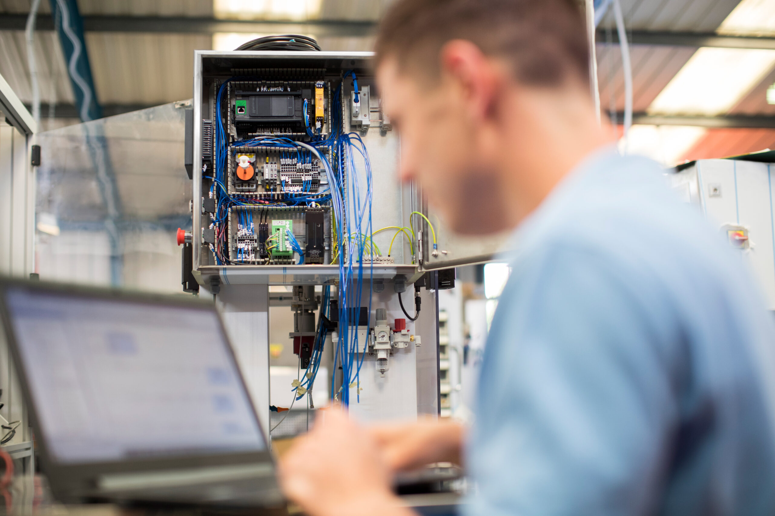 Engineer programming a PLC