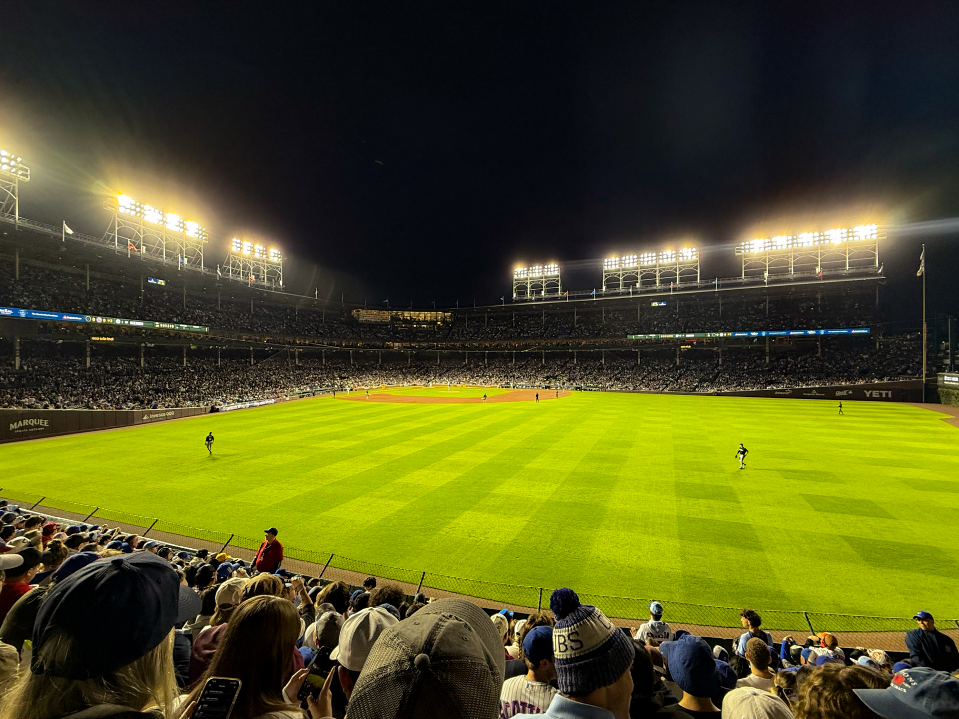 Baseball players in the outfield at Wrigley Field