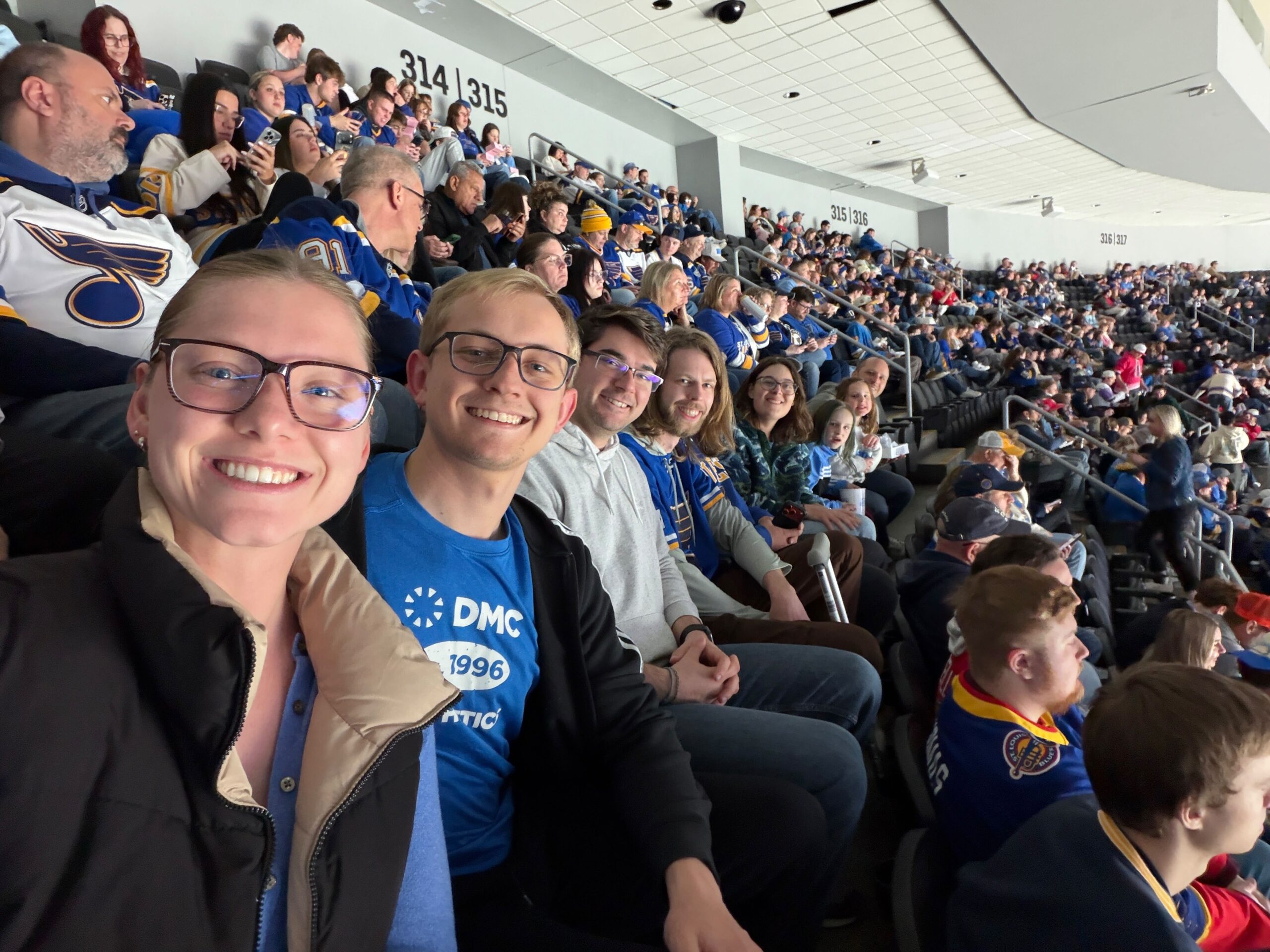 DMC St. Louis team members at a Blues game
