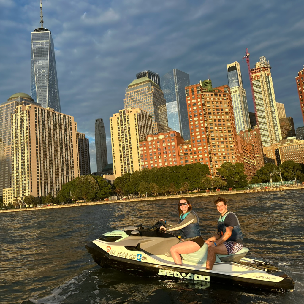 Two members of DMC NY on a jet ski in NY Harbor