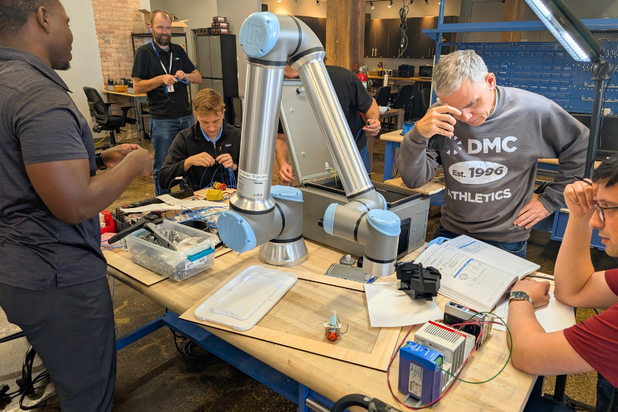 DMC Electrical Engineering Team readying schematics