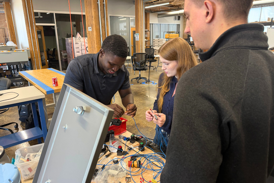 Electrical engineers wiring T&M's cobot