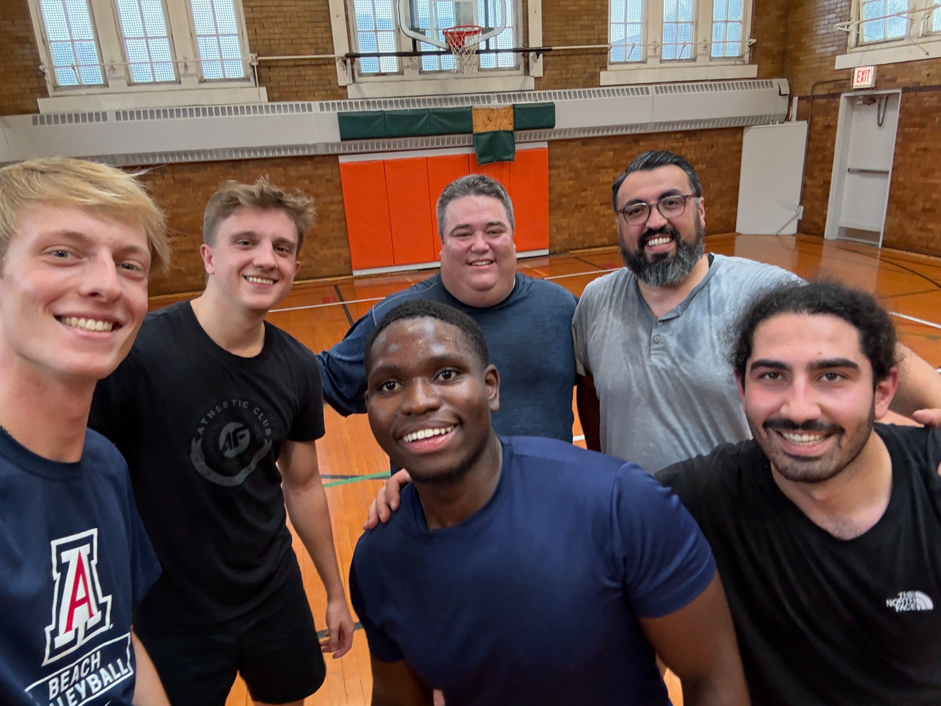DMC team members playing basketball after work
